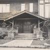 1908 photo shows entry porch with full eaves and a shallow flat bay for stair landing. Terrace was the same depth as porch, enclosed by a half-wall. Photo Environmental Design Archives, UC Berkeley