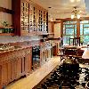 Recent view shows our galley kitchen with windows facing backyard.  Redwood lantern we designed for breakfast table was moved to a more prominent spot visible from entry.  Photo is coutesy of John Muir.