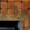 New fireplace header was intended to have patina of an old copper penny, and to blend with Grueby tile.  Photo courtesy of John Muir.