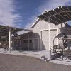 We designed new canopies to cover grape crushing equipment located in front of existing winery.  Structures are tubular steel with corrugated steel roofs.  Roofs match shallow pitch of additions to original barn.