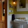 New master bath includes period fixtures owners found and reconditioned.  They retain patina of age and add a sense of authenticity to project.
