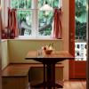 This sunny corner became a new breakfast alcove.  We designed trestle table and bench to fit.  Instead of a lift-top bench this has two deep drawers that pull out from ends.