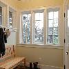 Inside mudroom entry there are Shaker pegs for coats and a black slate floor for wet shoes and bikes.