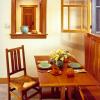 Breakfast room had been added to house before original construction was complete.  There was a built-in bench, so we designed a redwood trestle table to fit.