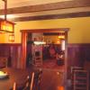 Restored dining room includes new custom redwood and art glass light fixtures.  Deep warm colors recreated original atmosphere.