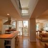 Our new kitchen, family room and dining room on main floor are open to one another and vertically to other floors.  New roof includes skylights above a light well to bring natural light into the center of the house.  See-through stairs have oak butcherblock treads.