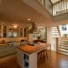 New kitchen includes island and office alcove.  Venting skylights above light well made a huge difference.  The space is bright and airy, and light is balanced throughout.