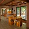 Original dining room is seen from entry with kitchen beyond. Our addition is slab on grade and aligns with original 1949 house. Quarry tile was added throughout for consistency.