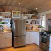 Footprint of new kitchen  projects into an existing bay with lower roof.  The curved ceiling allowed us to reconcile heights while keeping the space as tall as possible.