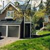 View shows "Carriage House" exterior entries and terminus of drive.  Studio apartment was intended for resident gardener, a perch for him to oversee his domain.  Inside is a single room with vaulted ceilings, wood stove, kitchenette and bath.