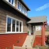 New entry porch roof is a cross gable supported by existing posts.  We did not modify stair, porch or decks, but added new stained cedar guardrails with slats for privacy.